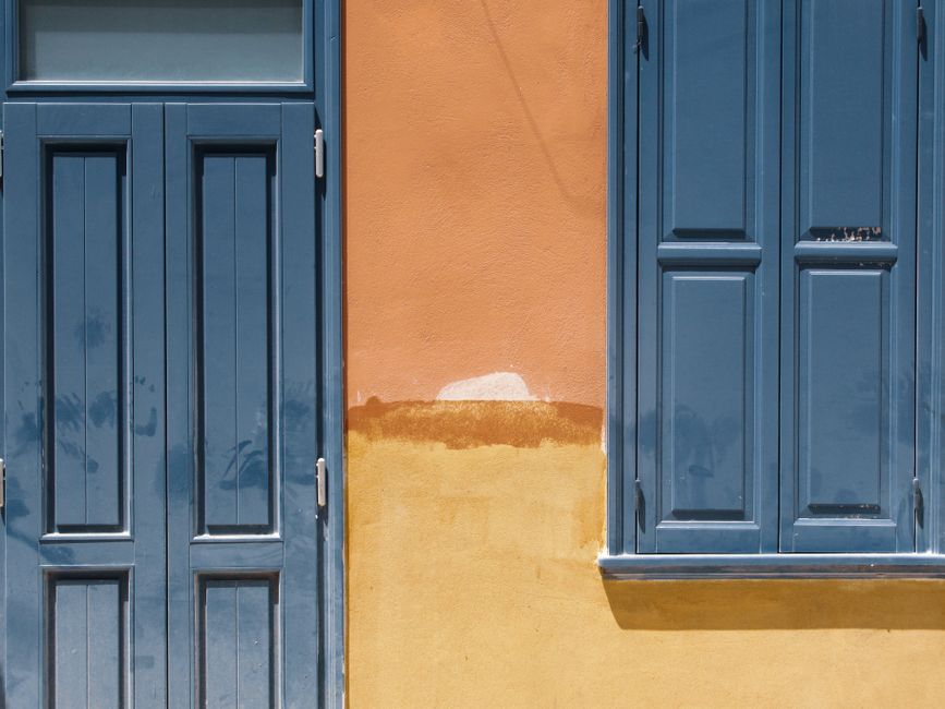A house front with painted shutters and trim